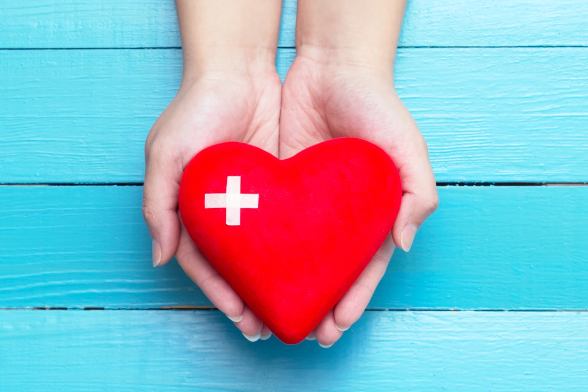 hand holding love with a plus sign