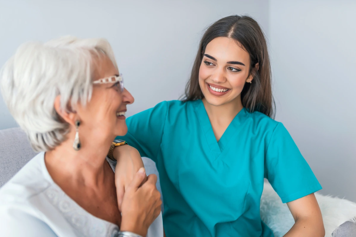 smiling female Carer with senior